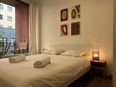 a bedroom with a bed with two pillows on it at Apartment B l Modern Stay with Parking in Prague