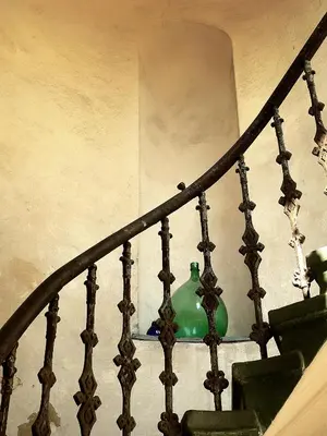 a green vase sitting on top of a staircase at Teytz Apartments in Prague