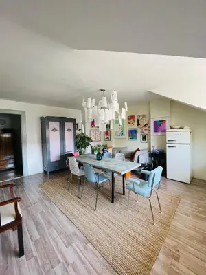 a dining room with a table and chairs at Flat with heart and art nearby centre of the Prague in Prague