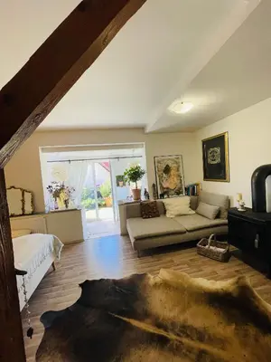 a large living room with a couch and a window at Flat with heart and art nearby centre of the Prague in Prague
