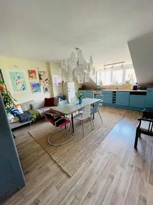 a living room with a table and a couch at Flat with heart and art nearby centre of the Prague in Prague