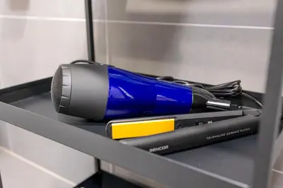 a pen and a mouse sitting on a shelf at Bright 2BR - 5th floor, Balcony, Free Parking by Gravity Prague in Prague