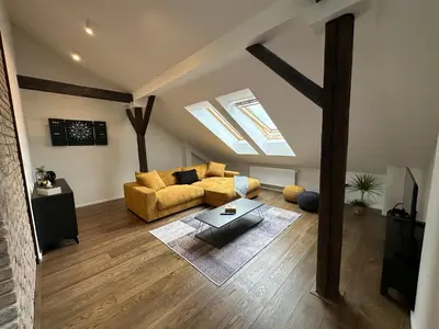 a living room with a couch and a table at LofT apartments Prague in Prague