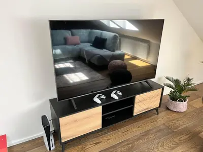 a living room with a large flat screen tv at LofT apartments Prague in Prague
