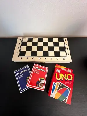 a chess board with three books and a chess board with a chess board at LofT apartments Prague in Prague