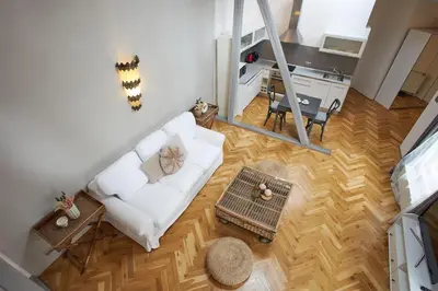 an overhead view of a living room with a white couch at Wenceslas Square Residence in Prague