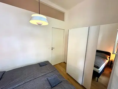 a bedroom with a bed and a room with a bed sqor at Luxury flat in Prague city center SUPERHOST - 5 STAR in Prague