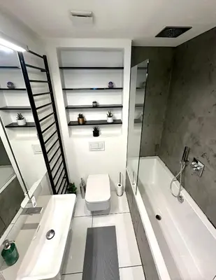 a bathroom with a toilet and a tub and a sink at Luxury flat in Prague city center SUPERHOST - 5 STAR in Prague