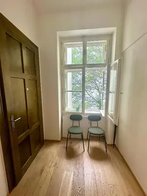 two chairs sitting in a room with a window at Luxury flat in Prague city center SUPERHOST - 5 STAR in Prague