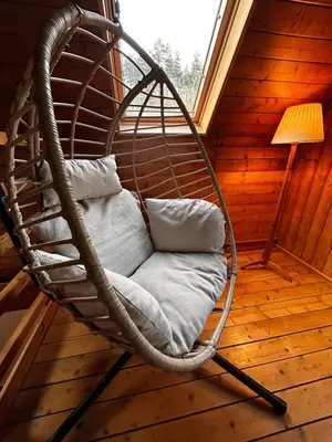 a small wooden sauna with a light on it at Cosy chalet with wellness in Mirošovice