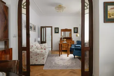 a living room with a couch and a chair at Vila Zlatý Slavík - Luxurious Villa with Spa in Jevany