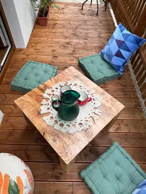 a table with a green tea pot on top of it at Chatinka Kersku in Hradišťko