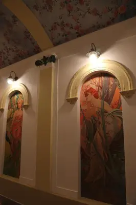 a room with two paintings on the wall at Arbes 20 - Family Suite in Prague