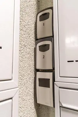 a wall with three toasters on the side of a refrigerator at Brand new two room apartment #23 with FREE parking in the city center in Prague