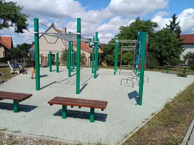 an empty playground with benches and a monkey bars at Bruno in Postřižín