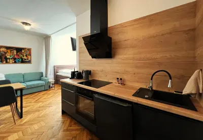 a kitchen with a sink and a stove top oven at Apartmán II centrum Praha in Prague