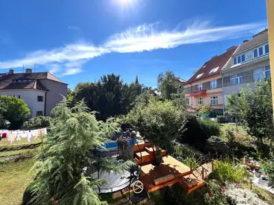a view of a yard with trees and buildings at Apartmán II centrum Praha in Prague