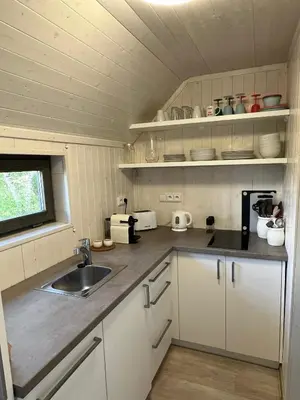 a kitchen with a sink and a counter top at Maringotka u lesa in Staňkovice