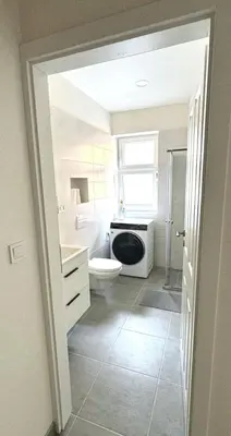a bathroom with a toilet and a sink at Hillside Studios in Prague