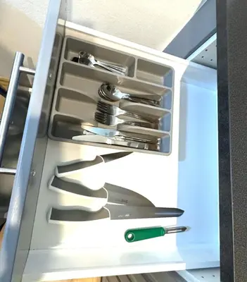 an open refrigerator filled with lots of knives at Hillside Studios in Prague