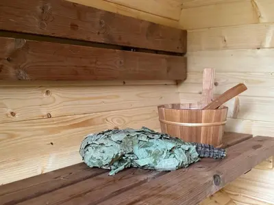 a room with a wooden table with a wooden bucket at Garden Residence - The Nest in Drahobudice