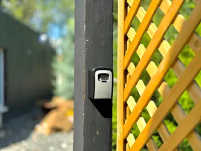 a metal door with a lock on a fence at Garden Residence - The Nest in Drahobudice