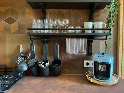 a shelf with glass jars filled with spices at Garden Residence - The Nest in Drahobudice