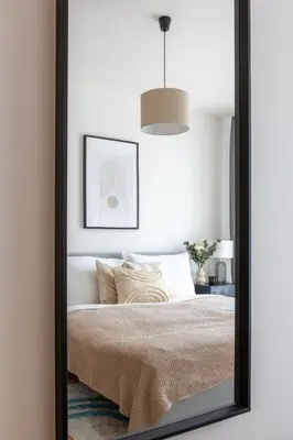 a mirror reflection of a bed in a bedroom at Prague Days - Two-bedroom Apartment with Balcony and Garage Parking in Smíchov in Prague