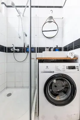 a washing machine in a bathroom with a shower at Prague Days - Studio with Netflix in Old Town in Prague