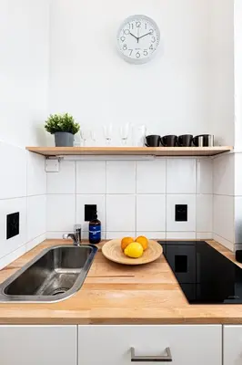 a kitchen with a sink and a plate of fruit at Prague Days - Studio with Netflix in Old Town in Prague