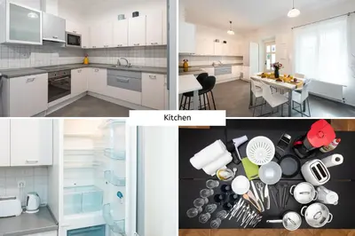 a kitchen with white cabinets and a dining room with a table at Hybernska Apartments by Pragueforyou in Prague