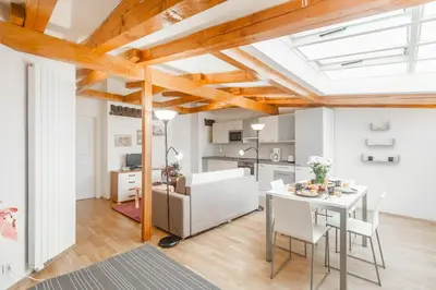 a kitchen and dining room with a table and chairs at Hybernska Apartments by Pragueforyou in Prague