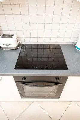 a kitchen counter top with a stove top oven at Hybernska Apartments by Pragueforyou in Prague