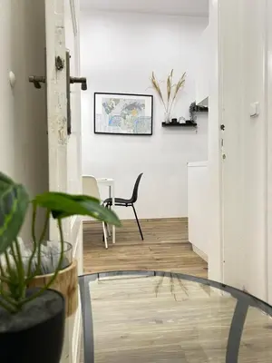 a room with a glass table and a chair at Entire unit in the center of Prague in Prague