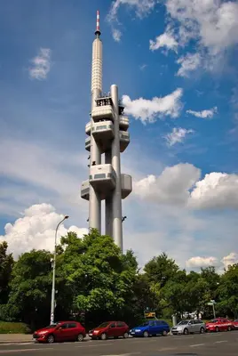 a tall building with cars parked in front of it at PB apartment Prague in Prague