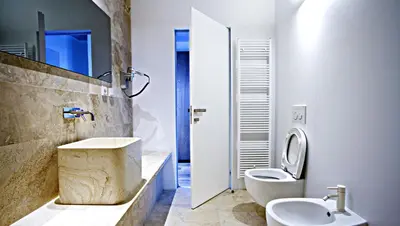 a bathroom with a toilet and a sink at Hotel Golden Crown in Prague