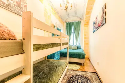 a small room with a bunk bed and a staircase at Wenceslas Palace Stay in Prague