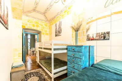 a bedroom with two bunk beds and a blue dresser at Wenceslas Palace Stay in Prague