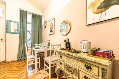 a room with a table and a dining room at Wenceslas Palace Stay in Prague