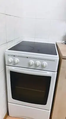 a white stove top oven in a kitchen at Prague Urban Retreat in Prague