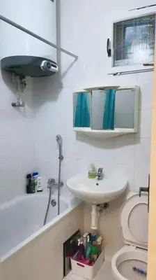 a bathroom with a sink and a toilet and a mirror at Prague Urban Retreat in Prague