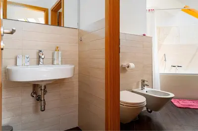 a bathroom with a sink and a toilet at Golden River Apartment in Prague