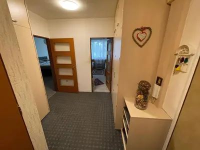 a hallway with a room with a heart on the wall at Apartmán Kamýk in Prague