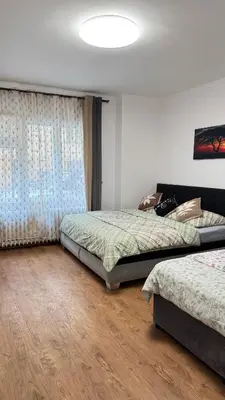 a bedroom with two beds and a window at Modern apartment in Old town Prague in Prague