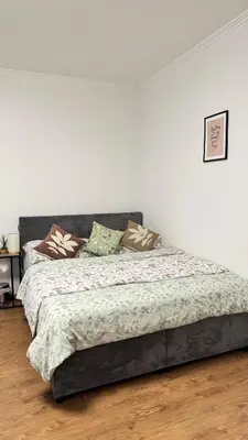 a bed with pillows on it in a bedroom at Modern apartment in Old town Prague in Prague