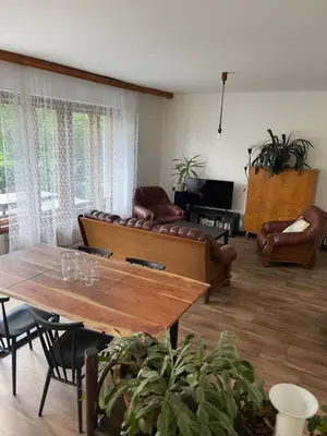 a living room with a couch and a table at Apartment s terasou Lysá in Lysá nad Labem