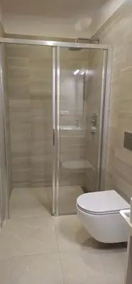 a bathroom with a shower and a toilet at Hotel Karlova Prague in Prague