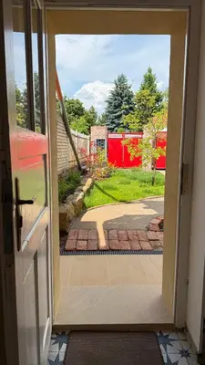 an open door with a view of a yard at Četnická Stanice Mšeno in Mšeno