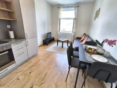 a living room with a couch and a table at Isabel's Suites in Prague