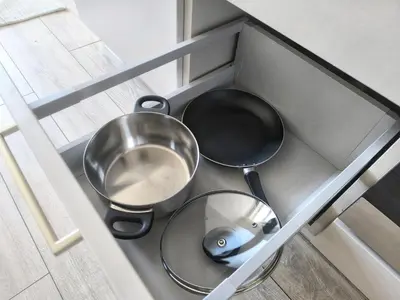 a kitchen counter with two pans and a pan at Isabel's Suites in Prague